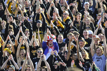 IOWA CITY, IA - OCTOBER 30- University of Iowa Hawkeyes fans cheer on their team during play against the Michigan State Spartans at Kinnick Stadium on October 30, 2010 in Iowa City, Iowa. Iowa won 37-6 over Michigan State. (Photo by David Purdy/Getty Imag