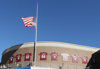 CHESTNUT HILL, MA - SEPTEMBER 11:  The flag is raised to  half staff in honor of the 9/11 attacks during the game between the Boston College Eagles and the Kent State Golden Flashes on September 11, 2010 at Alumni Stadium in Chestnut Hill, Massachusetts. 
