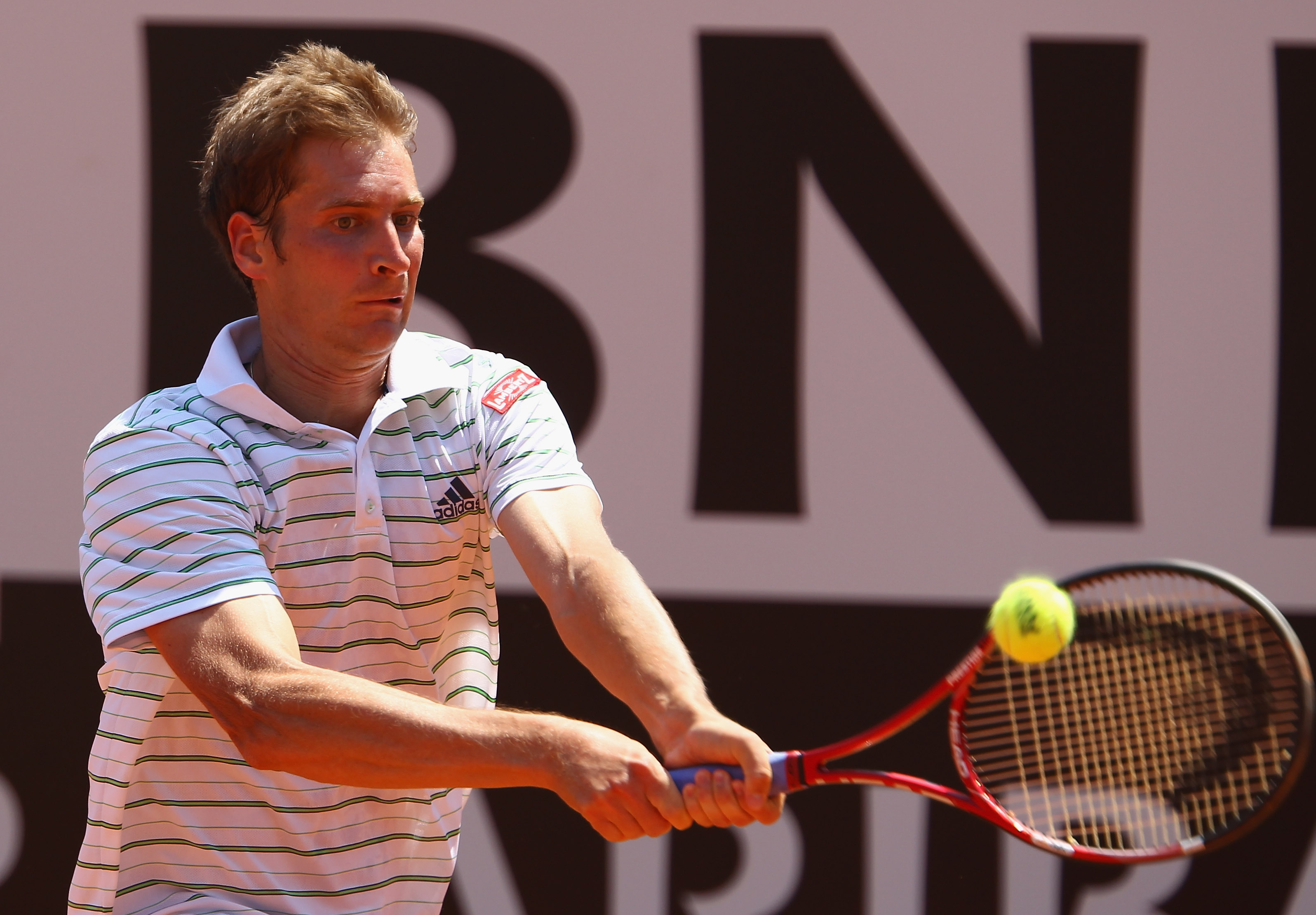 ROME, ITALY - MAY 13: Florian Mayer of Germany plays a backhand during his quarter final match against Andy Murray of Great Britain during day six of the Internazoinali BNL D'Italia at the Foro Italico Tennis Centre on May 13, 2011 in Rome, Italy. (Pho