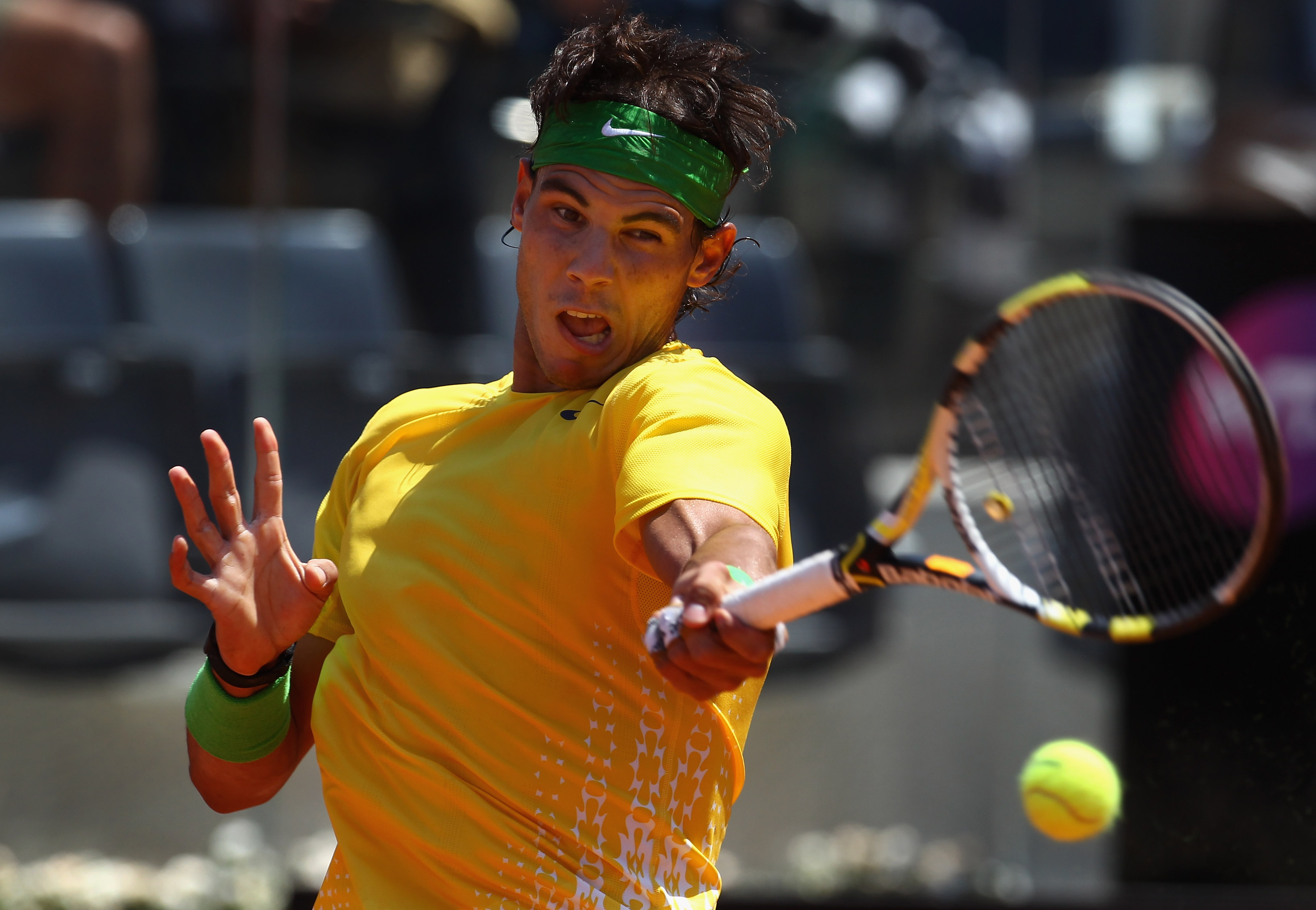 ROME, ITALY - MAY 12:  Rafael Nadal of Spain hits a forehand return during his third round match against Feliciano Lopez of Spain during day five of the Internazionali BNL d'Italia at the Foro Italico Tennis Centre on May 12, 2011 in Rome, Italy.  (Photo