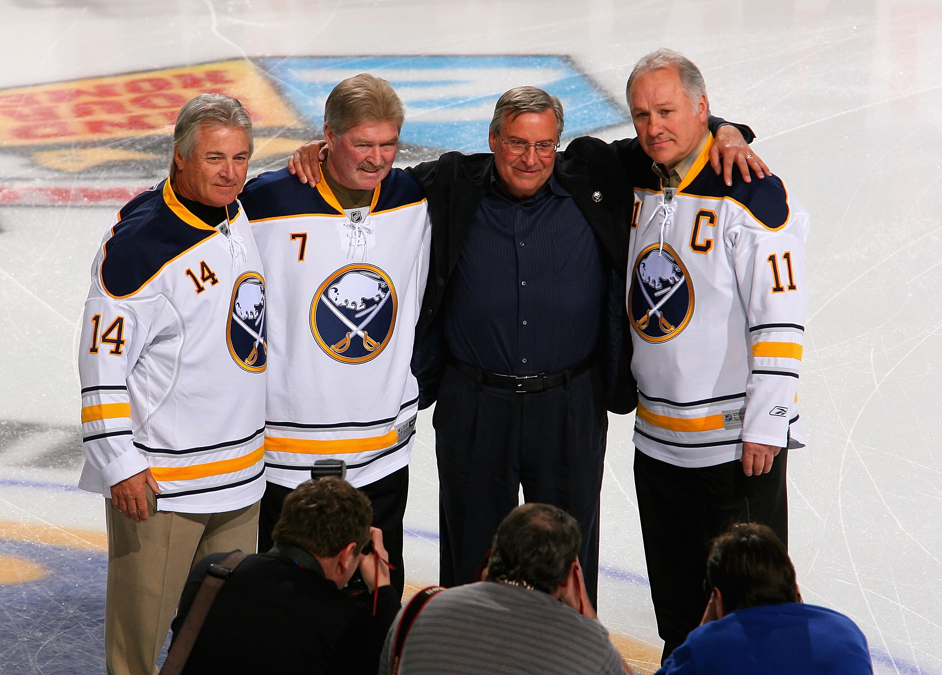 BUFFALO, NY - FEBRUARY 23:  New Buffalo Sabres owner Terry Pegula stands with former Sabres palyers Rene Robert #14, Rick Martin #7 and Gilbert Perrault #11  during pre game ceremonies prior to play against the Atlanta Thrashers at HSBC Arena on February