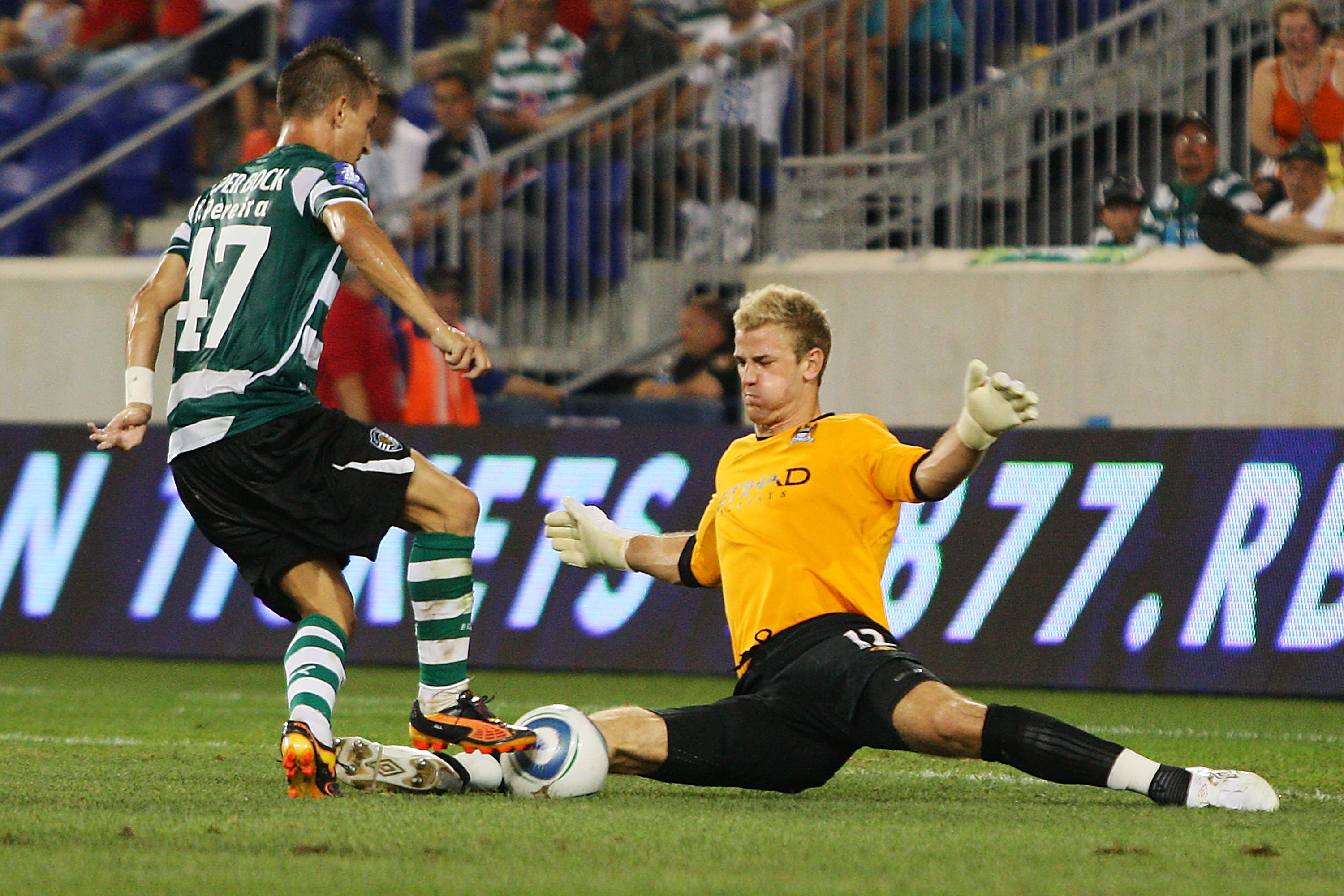 HARRISON, NJ - JULY 23:  Goalkeeper Joe Hart #12 of Manchester City makes a save against Joao Pereira #47 of Sporting Lisbon in the Barclays New York Challenge July 23, 2010 at Red Bull Arena in Harrison, New Jersey. Sporting Lisbon won 2-0.  (Photo by Mi