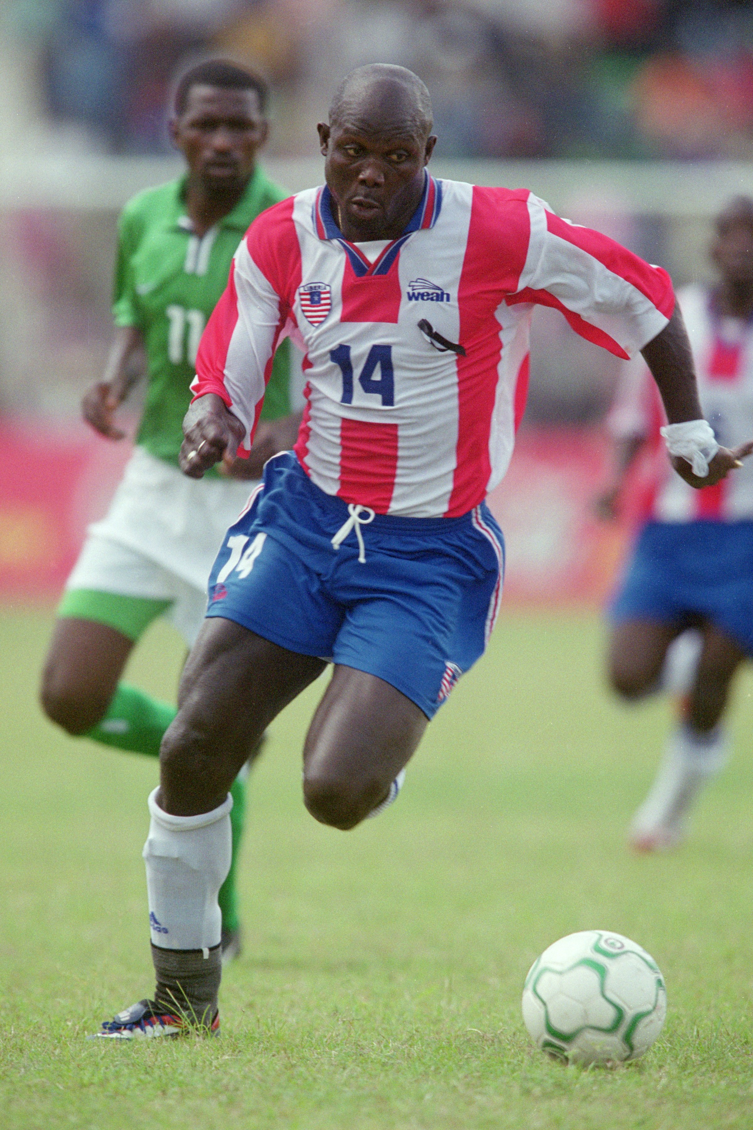 5 May 2001:  George Weah of Liberia runs with the ball during the World Cup 2002 Group B Second Round Qualifying match against Nigeria played at Port Harcourt, in Nigeria. Nigeria won the match 2-0. \ Mandatory Credit: Ben Radford /Allsport