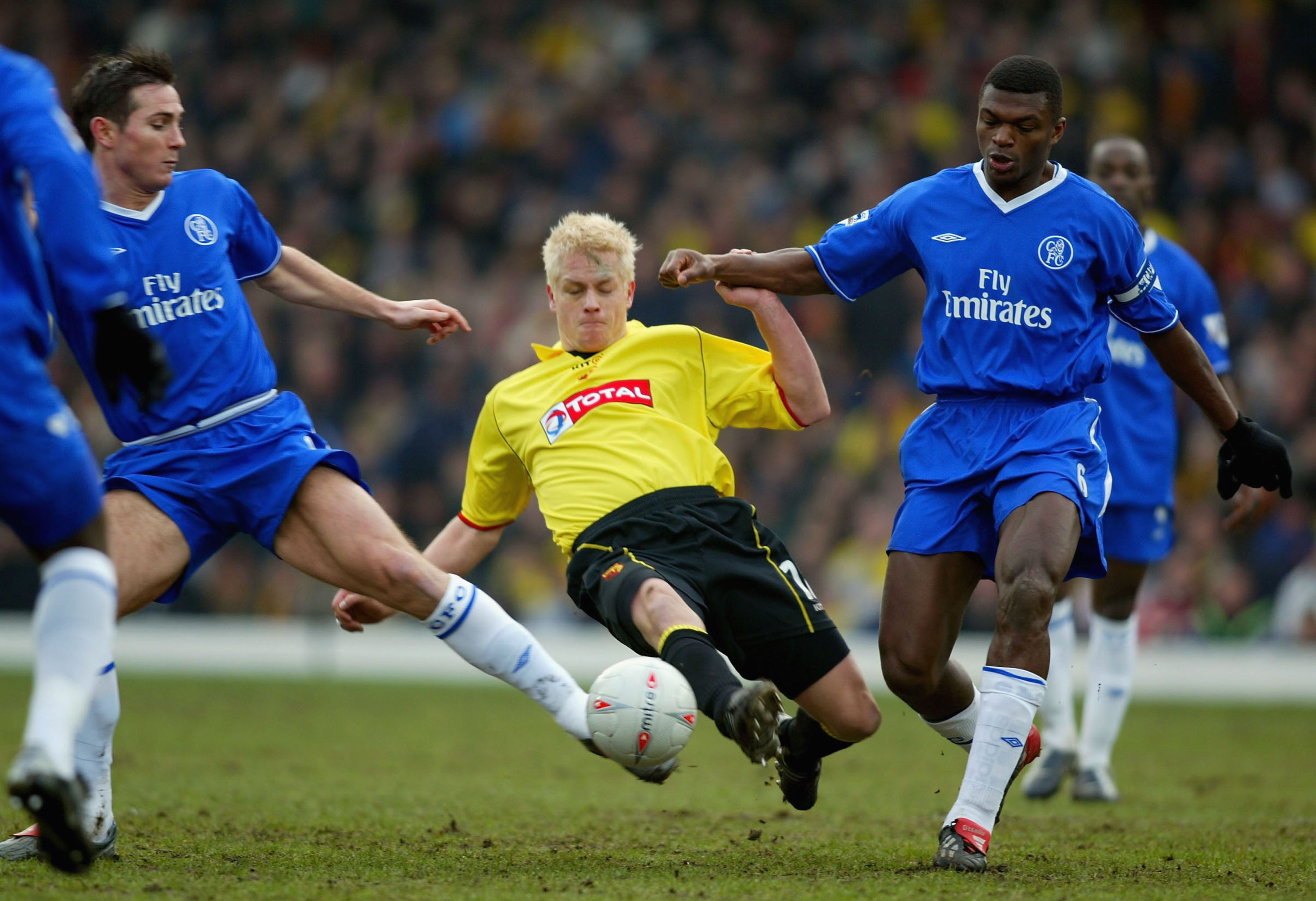 WATFORD, ENGLAND - JANUARY 3:  Frank Lampard and Marcel Desaily of Chelsea tries to tackle Heidar Helguson of Watford during the FA Cup Third Round match between Watford and Chelsea at Vicarage Road on January 3, 2004 in Watford, England. (Photo by Ben Ra