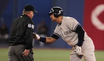 TORONTO, ON - APRIL 20:  Alex Rodriguez #13 of the New York Yankees chats with umpite Jim Joyce after being called out at second during their game against the Toronto Blue Jays at Rogers Centre on April 20, 2011 in Toronto, Canada.  (Photo by Scott Haller