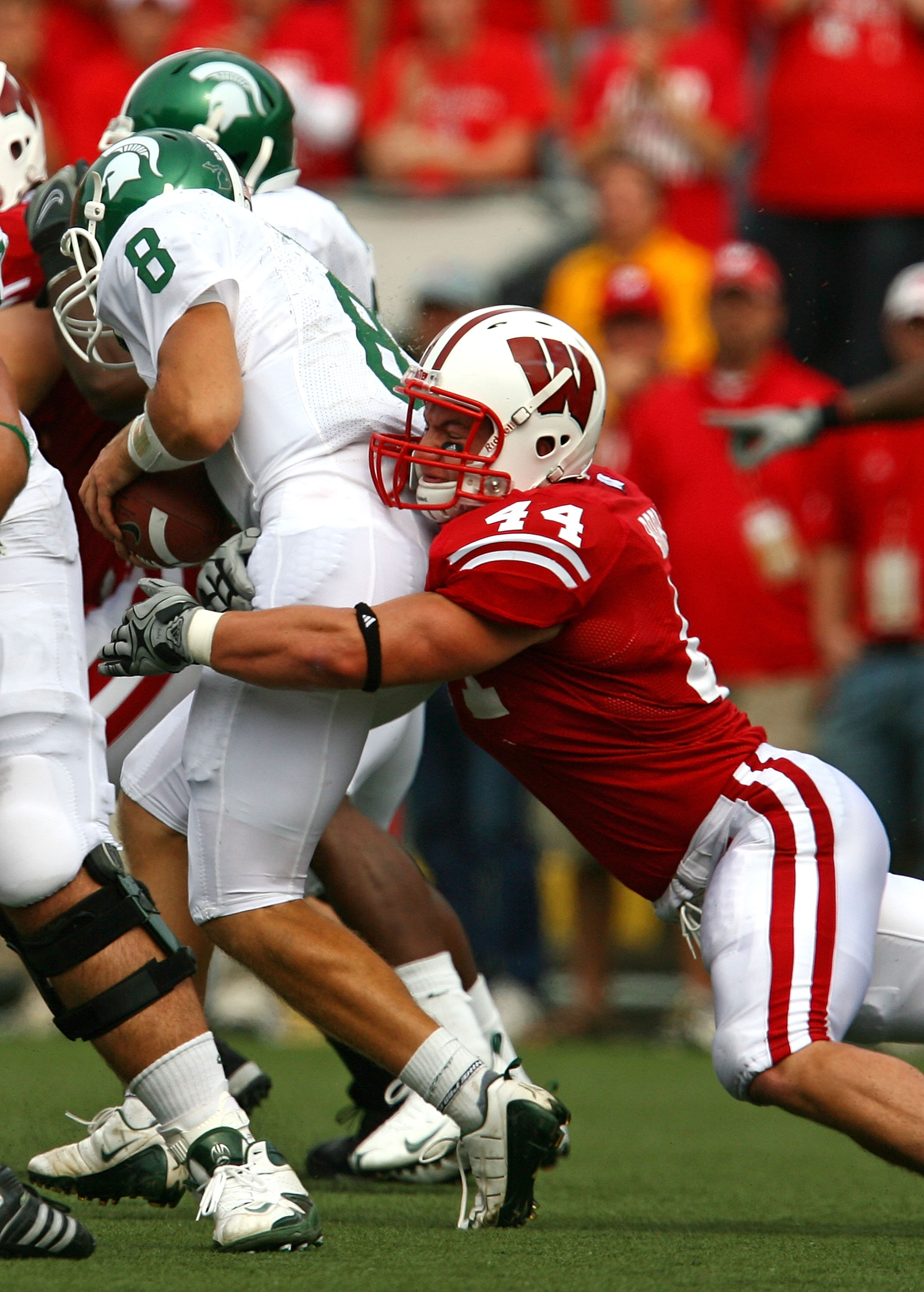 MADISON, WI - SEPTEMBER 26: Chris Borland #44 of the Wisconsin Badgers sacks Kirk Cousins #8 of the Michigan State Spartans on September 26, 2009 at Camp Randall Stadium in Madison, Wisconsin. Wisconsin defeated Michigan State 38-30. (Photo by Jonathan Da