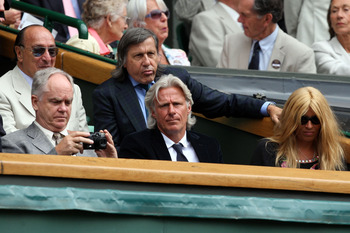 WIMBLEDON, ENGLAND - JULY 03:  Ilie Nastase (3R), Bjorn Borg (2R) and wife his Patricia (R) look on from Centre Court on Day Eleven of the Wimbledon Lawn Tennis Championships at the All England Lawn Tennis and Croquet Club on July 3, 2009 in London, Engla