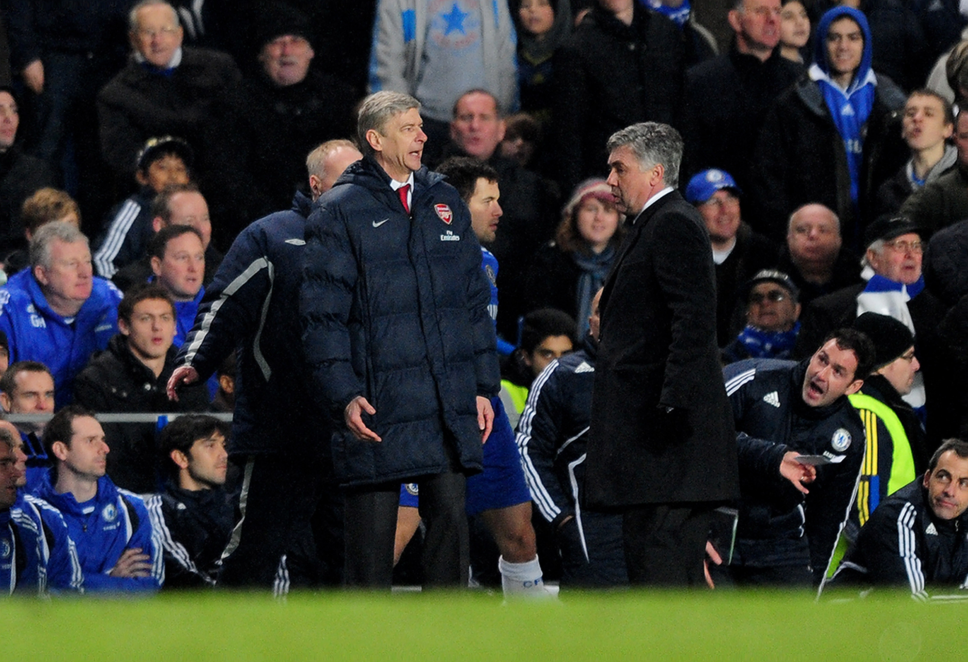 LONDON, ENGLAND - FEBRUARY 07:  Chelsea Manager Carlo Ancelotti (R) and Arsenal Manager Arsene Wenger speak during the Barclays Premier League match between Chelsea and Arsenal at Stamford Bridge on February 7, 2010 in London, England.  (Photo by Mike Hew