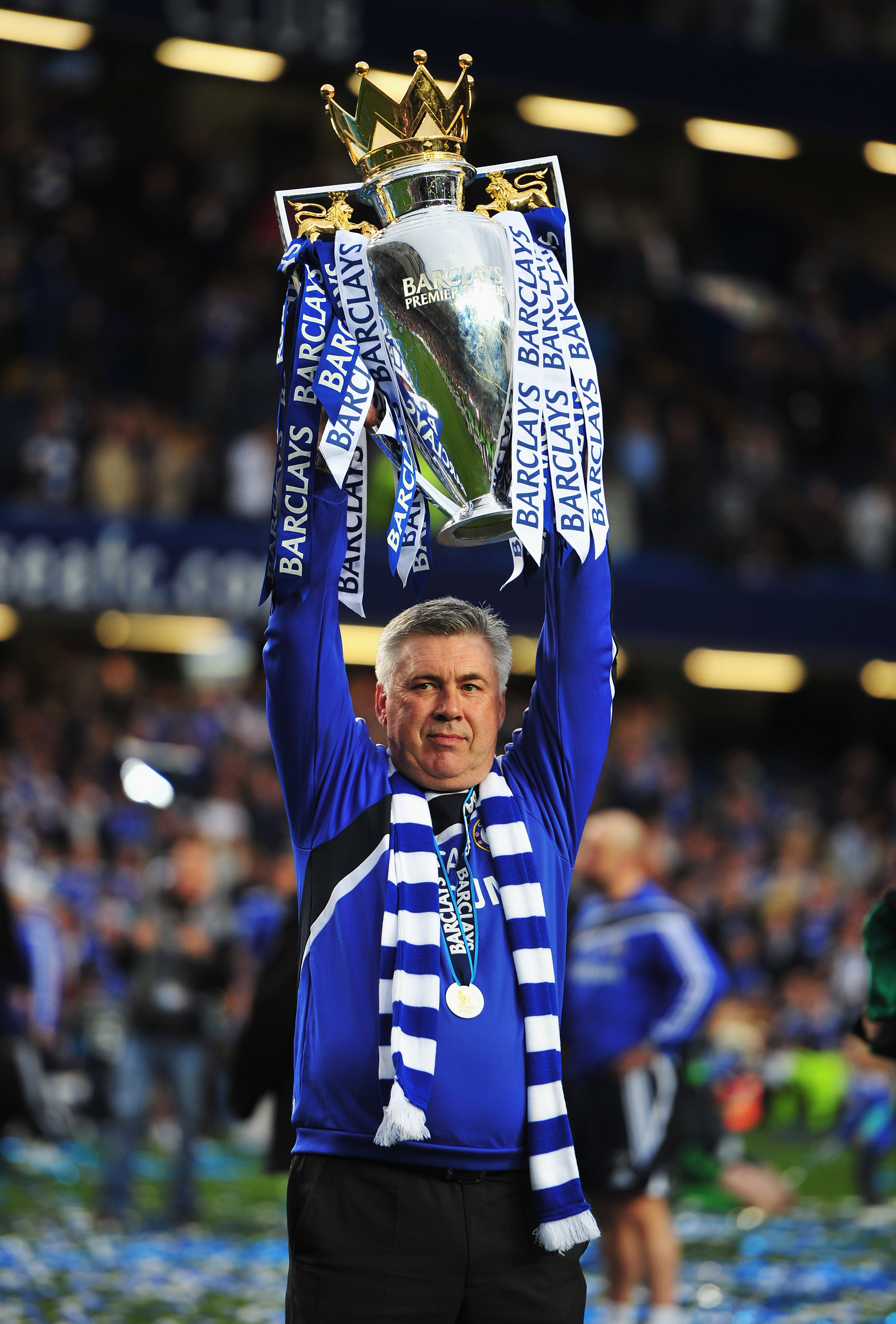 LONDON, ENGLAND - MAY 09:  Carlo Ancelotti manager of Chelsea celebrates with the trophy as they win the title after the Barclays Premier League match between Chelsea and Wigan Athletic at Stamford Bridge on May 9, 2010 in London, England. Chelsea won 8-0