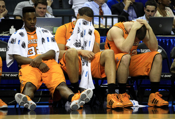 CHARLOTTE, NC - MARCH 18:  (L-R) Scotty Hopson #32, Brian Williams #33 and Steven Pearl #22 of the Tennessee Volunteers sit on the bench late in the second half before losing to the Michigan Wolverines 75-45 during the second round of the 2011 NCAA men's