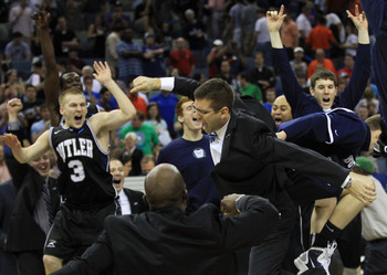 NEW ORLEANS, LA - MARCH 26:  Head coach Brad Stevens of the Butler Bulldogs celebrates with his team after they defeated the Florida Gators 74 to 71 in overtime during the Southeast regional final of the 2011 NCAA men's basketball tournament at New Orlean