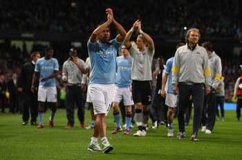 MANCHESTER, ENGLAND - MAY 17:  Carlos Tevez of Manchester City waves to the crowd on a lap of honour after the Barclays Premier League match between Manchester City and Stoke City at City of Manchester Stadium on May 17, 2011 in Manchester, England.  (Pho