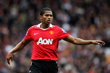 BLACKBURN, ENGLAND - MAY 14:  Antonio Valencia of Manchester United speaks to a team mate during the Barclays Premier League match between Blackburn Rovers and Manchester United at Ewood park on May 14, 2011 in Blackburn, England.  (Photo by Dean Mouhtaro