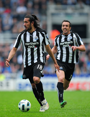 NEWCASTLE UPON TYNE, ENGLAND - MAY 07:  Newcastle player Jonas Gutierrez (l) and Jose Enrique bomb down the left flank during the Barclays  Premier League game between Newcastle United and Birmingham City at St James' Park on May 7, 2011 in Newcastle upon