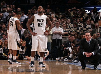 NEW YORK - MARCH 11: Jermaine Dixon #24, Brad Wanamaker #22 and head coach Jamie Dixon of the Pittsburgh Panthers look on after being defeated by the Notre Dame Fighting Irish during the quarterfinal of the 2010 NCAA Big East Tournament at Madison Square