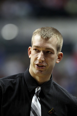 INDIANAPOLIS, IN - MARCH 11:  Injured player Robbie Hummel of the Purdue Boilermakers looks on against the Michigan State Spartans during the quarterfinals of the 2011 Big Ten Men's Basketball Tournament at Conseco Fieldhouse on March 11, 2011 in Indianap
