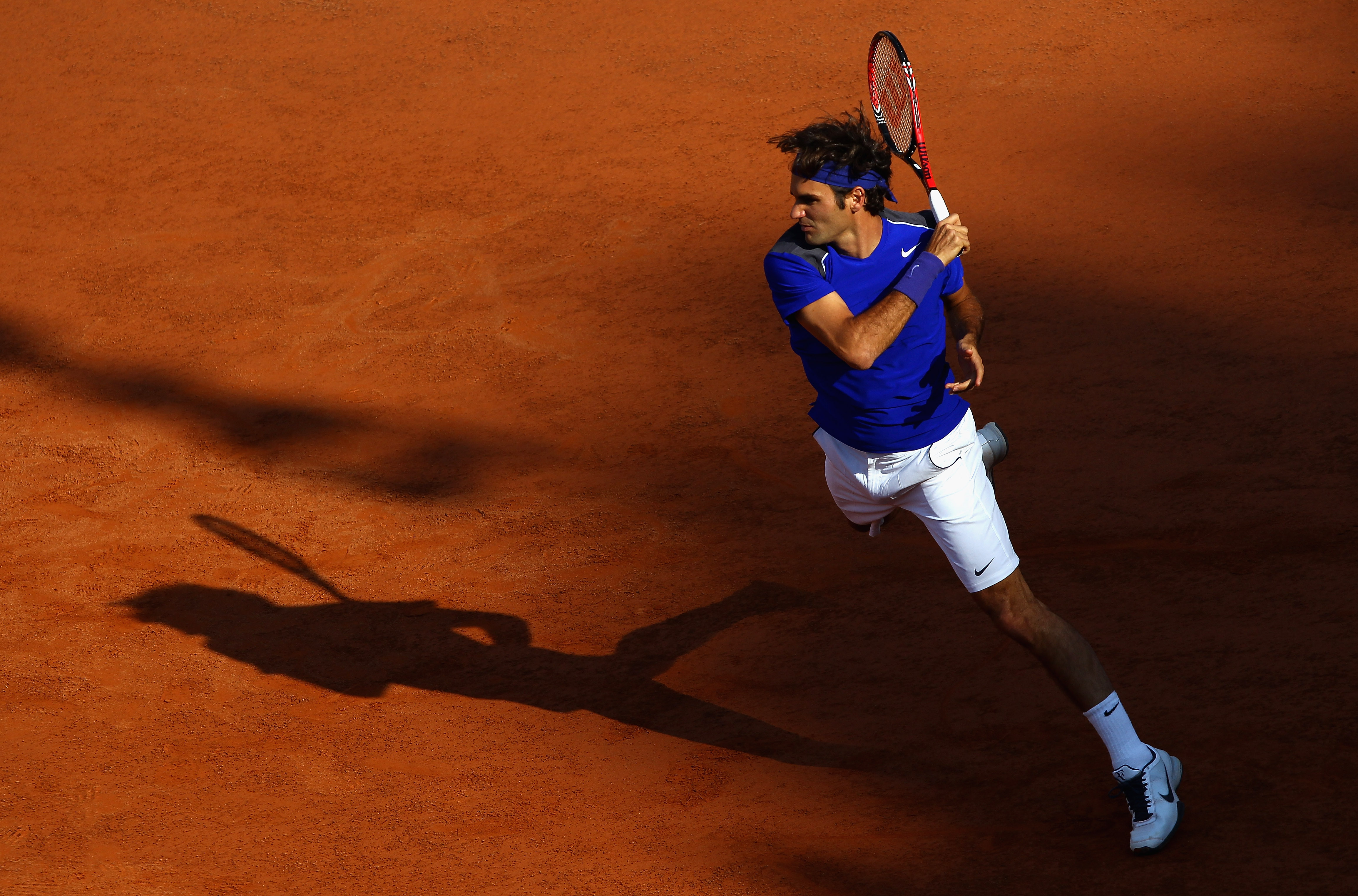 ROME, ITALY - MAY 12:  Roger Federer of Switzerland in action during his third round match against Richard Gasquet of France during day five of the Internazoinali BNL D'Italia at the Foro Italico Tennis Centre on May 12, 2011 in Rome, Italy.  (Photo by Cl