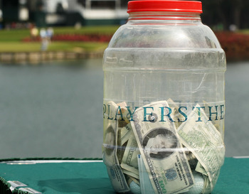PONTE VEDRA BEACH, FL - MAY 11:  The money jar for the 'Caddie Challenge' is seen on the 17th hole during a practice round prior to the start of THE PLAYERS Championship held at THE PLAYERS Stadium course at TPC Sawgrass on May 11, 2011 in Ponte Vedra Bea