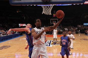 NEW YORK, NY - MARCH 08: Jamal Coombs-McDaniel #4 of the Connecticut Huskies lays the ball up against Jimmy Drew #23 of the DePaul Blue Demons at Madison Square Garden on March 8, 2011 in New York City.  (Photo by Nick Laham/Getty Images)