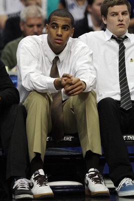 DENVER, CO - MARCH 17:  Brandon Davies of the Brigham Young Cougars looks on from the bench as his team takes on the Wofford Terriers during the second round of the 2011 NCAA men's basketball tournament at Pepsi Center on March 17, 2011 in Denver, Colorad