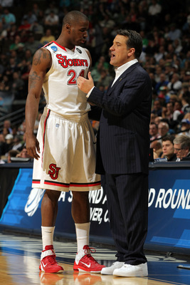 DENVER, CO - MARCH 17:  Head coach Steve Lavin of the St. John's Red Storm talks with Justin Burrell #24 against the Gonzaga Bulldogs during the second round of the 2011 NCAA men's basketball tournament at Pepsi Center on March 17, 2011 in Denver, Colorad