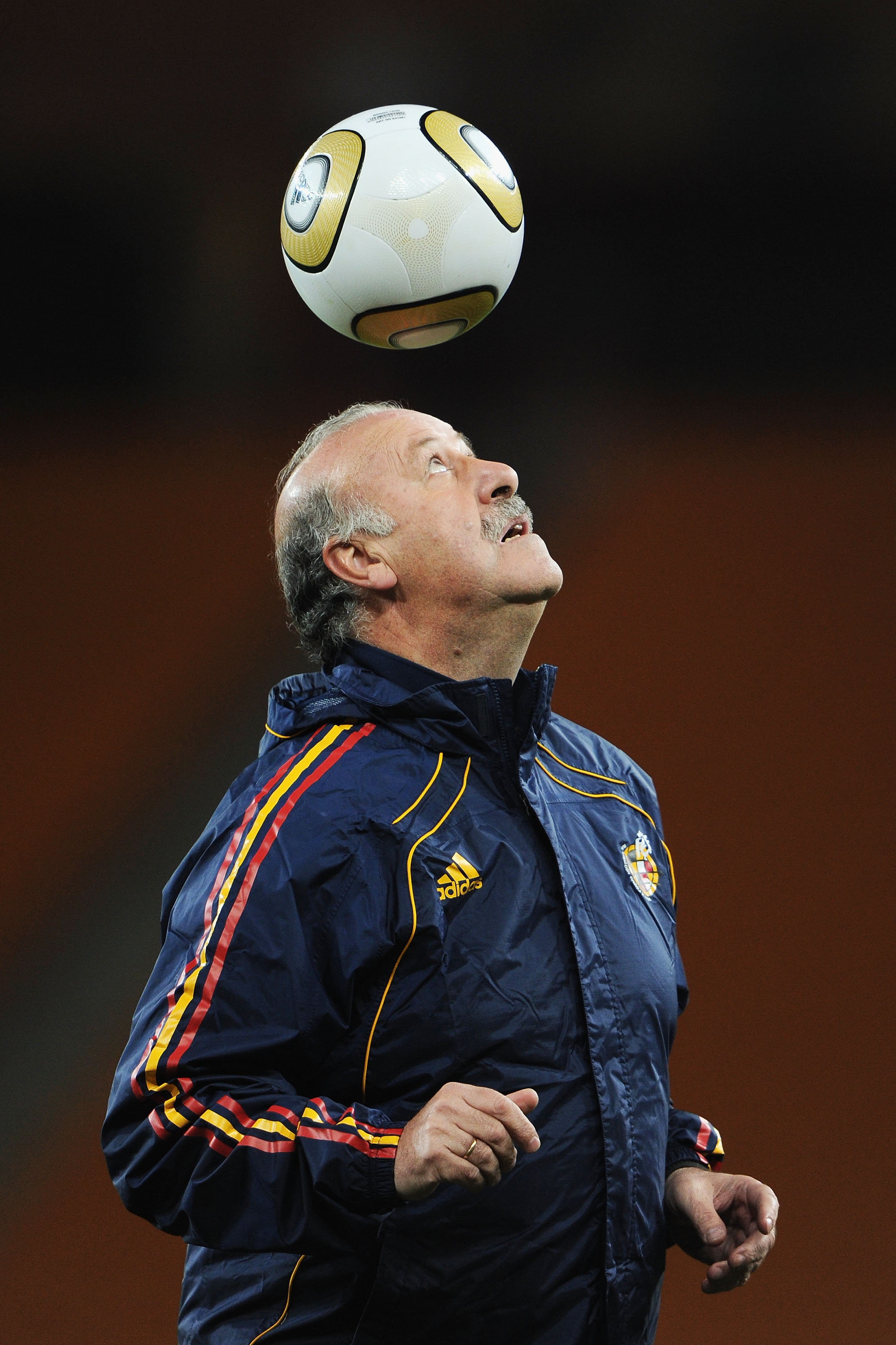 JOHANNESBURG, SOUTH AFRICA - JULY 10:  Vicente del Bosque Head Coach of Spain controls a ball with his head during a Spain training session, ahead of the 2010 FIFA World Cup Final, at Soccer City Stadium on July 10, 2010 in Johannesburg, South Africa.  (P