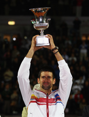 ROME, ITALY - MAY 15:  Novak Djokovic of Serbia holds the trophy aloft after his victory in the final against Rafael Nadal of Spain during day eight of the Internazoinali BNL D'Italia at the Foro Italico Tennis Centre on May 15, 2011 in Rome, Italy.  (Pho