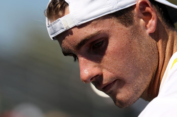 KEY BISCAYNE, FL - MARCH 27:  John Isner looks on against Alex Bogomolov Jr. during the Sony Ericsson Open at Crandon Park Tennis Center on March 27, 2011 in Key Biscayne, Florida.  (Photo by Clive Brunskill/Getty Images)
