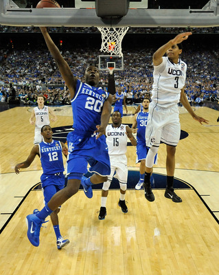 HOUSTON, TX - APRIL 02:  Doron Lamb #20 of the Kentucky Wildcats goes to the hoop against Jeremy Lamb #3 of the Connecticut Huskies during the National Semifinal game of the 2011 NCAA Division I Men's Basketball Championship at Reliant Stadium on April 2,