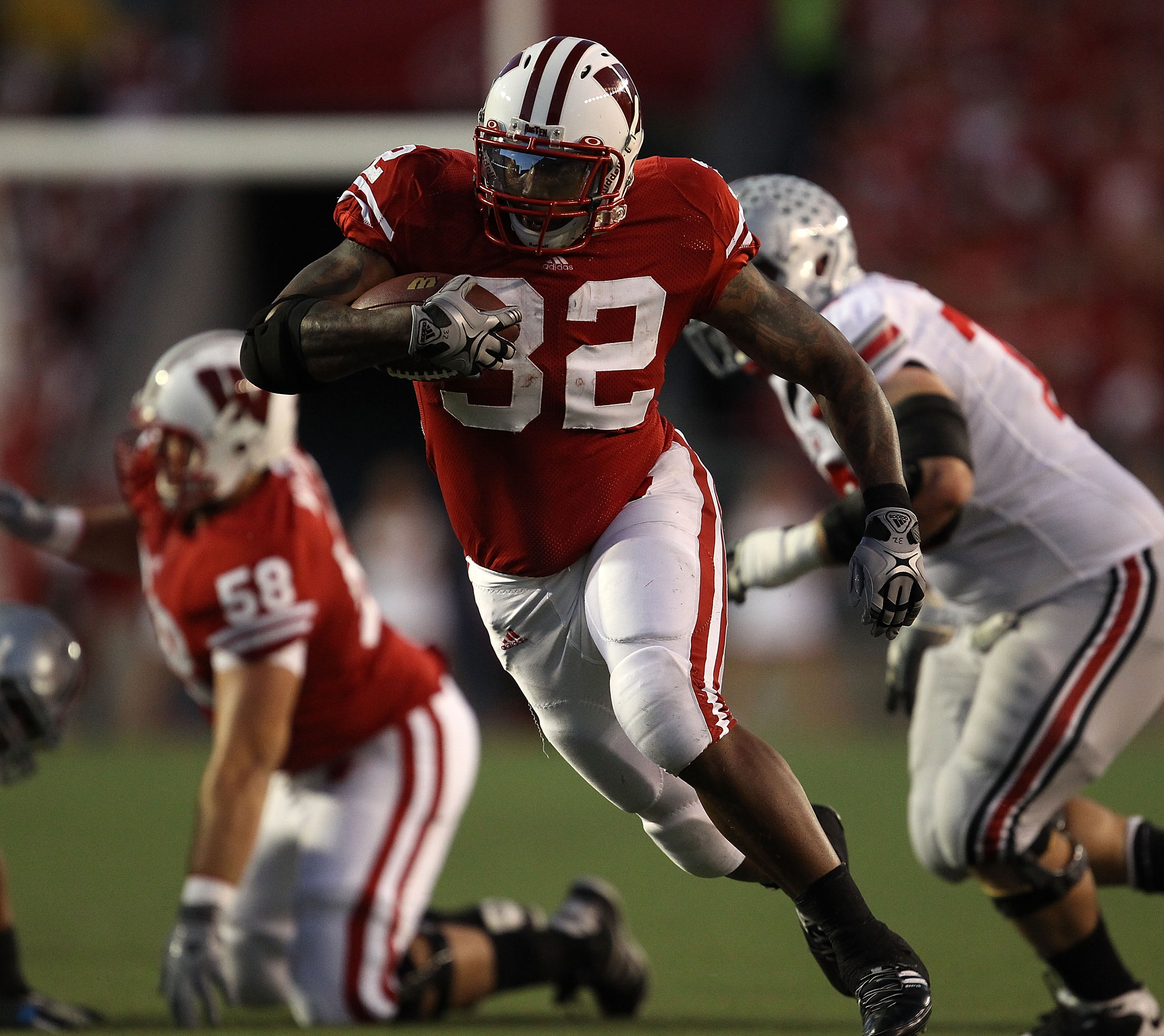 MADISON, WI - OCTOBER 16: John Clay #32 of the Wisconsin Badgers runs for a first down against the Ohio State Buckeyes at Camp Randall Stadium on October 16, 2010 in Madison, Wisconsin. (Photo by Jonathan Daniel/Getty Images)