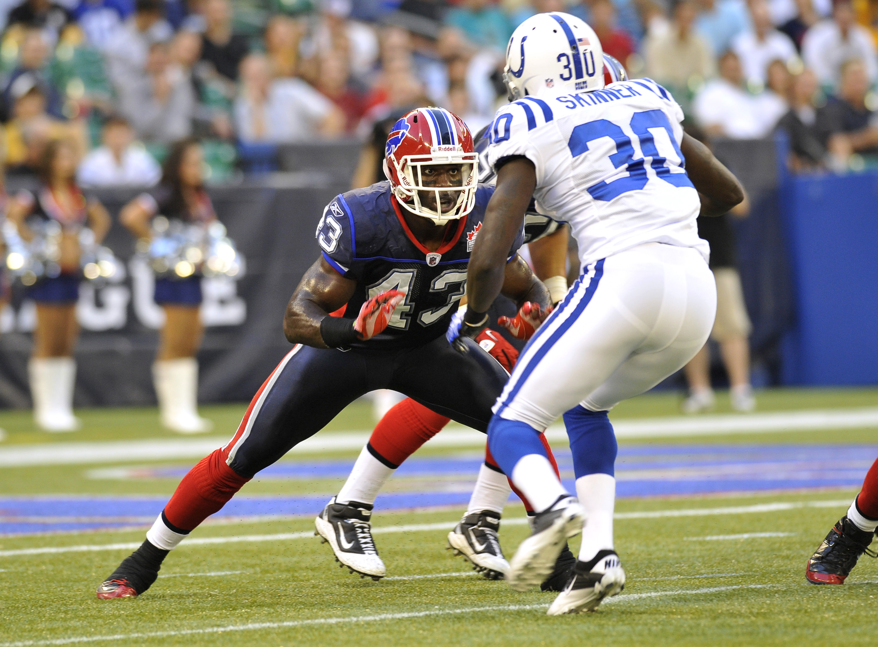 TORONTO, CANADA - AUGUST 19: Bryan Scott #43 of the Buffalo Bills defends against Terrell Skinner #30 of the Indianapolis Colts during game action August 19, 2010 at the Rogers Centre in Toronto, Ontario, Canada. (Photo by Brad White/Getty Images)