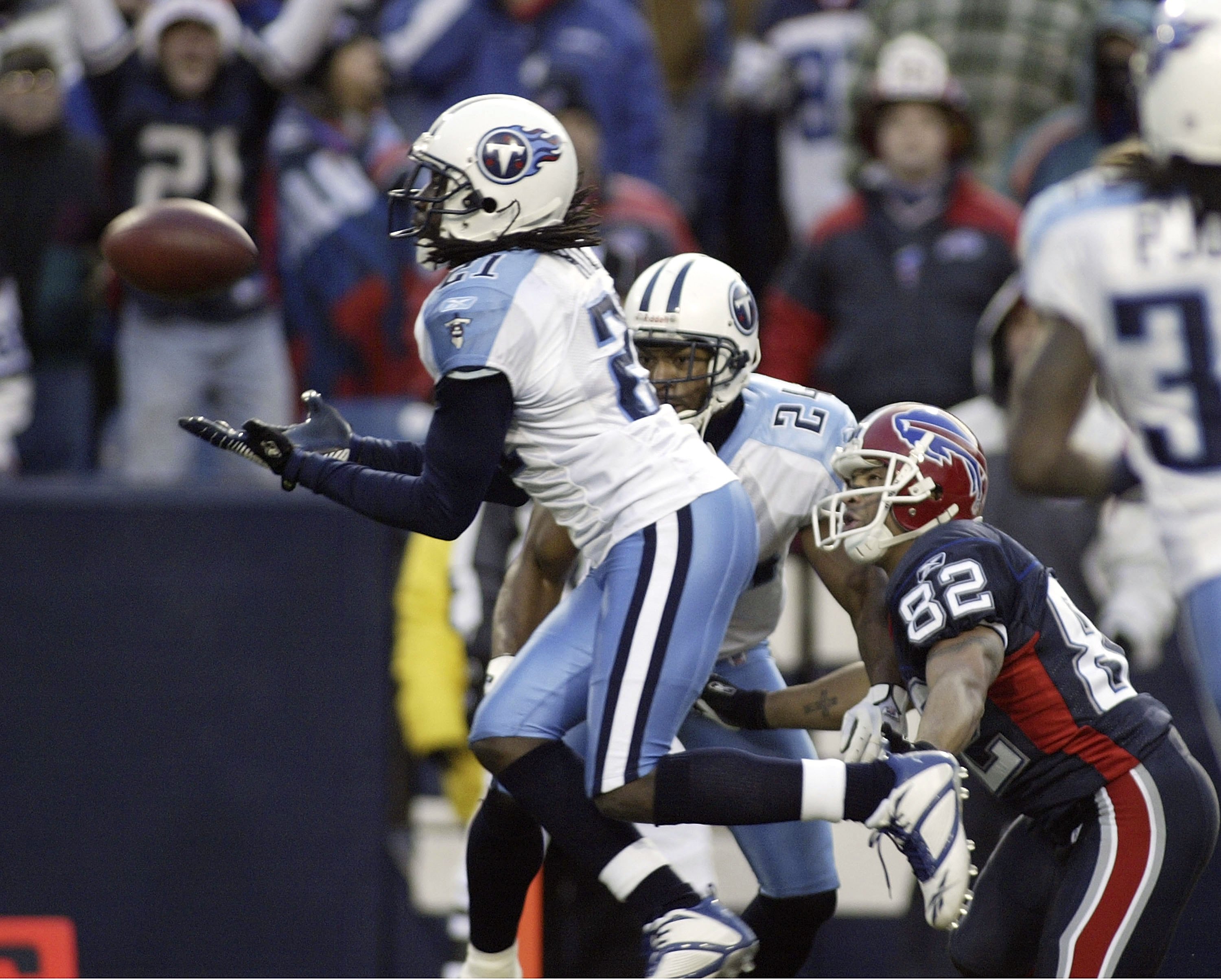 ORCHARD PARK, NY - DECEMBER 24: Reynaldo Hill #21 of the Tennessee Titans intercepts a pass intended for Josh Reed #82 of the Buffalo Bills on December 24, 2006 at Ralph Wilson Stadium in Orchard Park, New York. The Titans defeated the Bills 30-29. (Pho