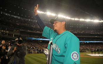 SEATTLE - APRIL 08:  Starting pitcher Felix Hernandez #34 of the Seattle Mariners waves to the crowd after receiving his American League Cy Young Award trophy prior to the Mariners' home opener against the Cleveland Indians at Safeco Field on April 8, 201