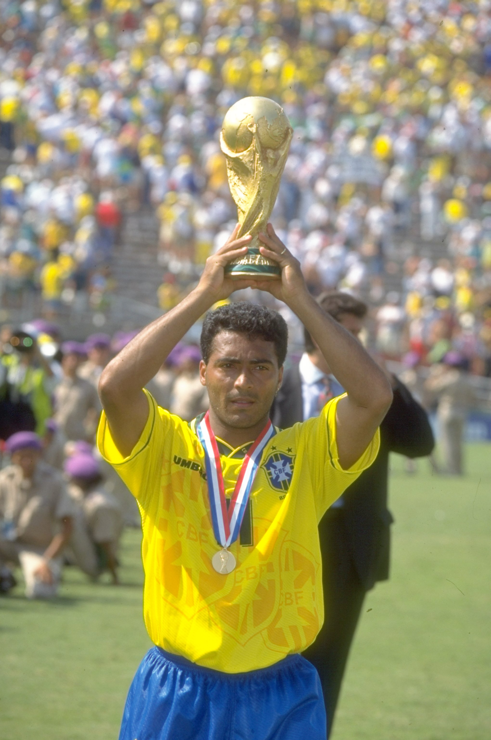 17 Jul 1994:  Romario of Brazil holds the trophy aloft after the World Cup final against Italy at the Rose Bowl in Los Angeles, California, USA. Brazil won the match 3-2 on penalties. \ Mandatory Credit: Simon  Bruty/Allsport