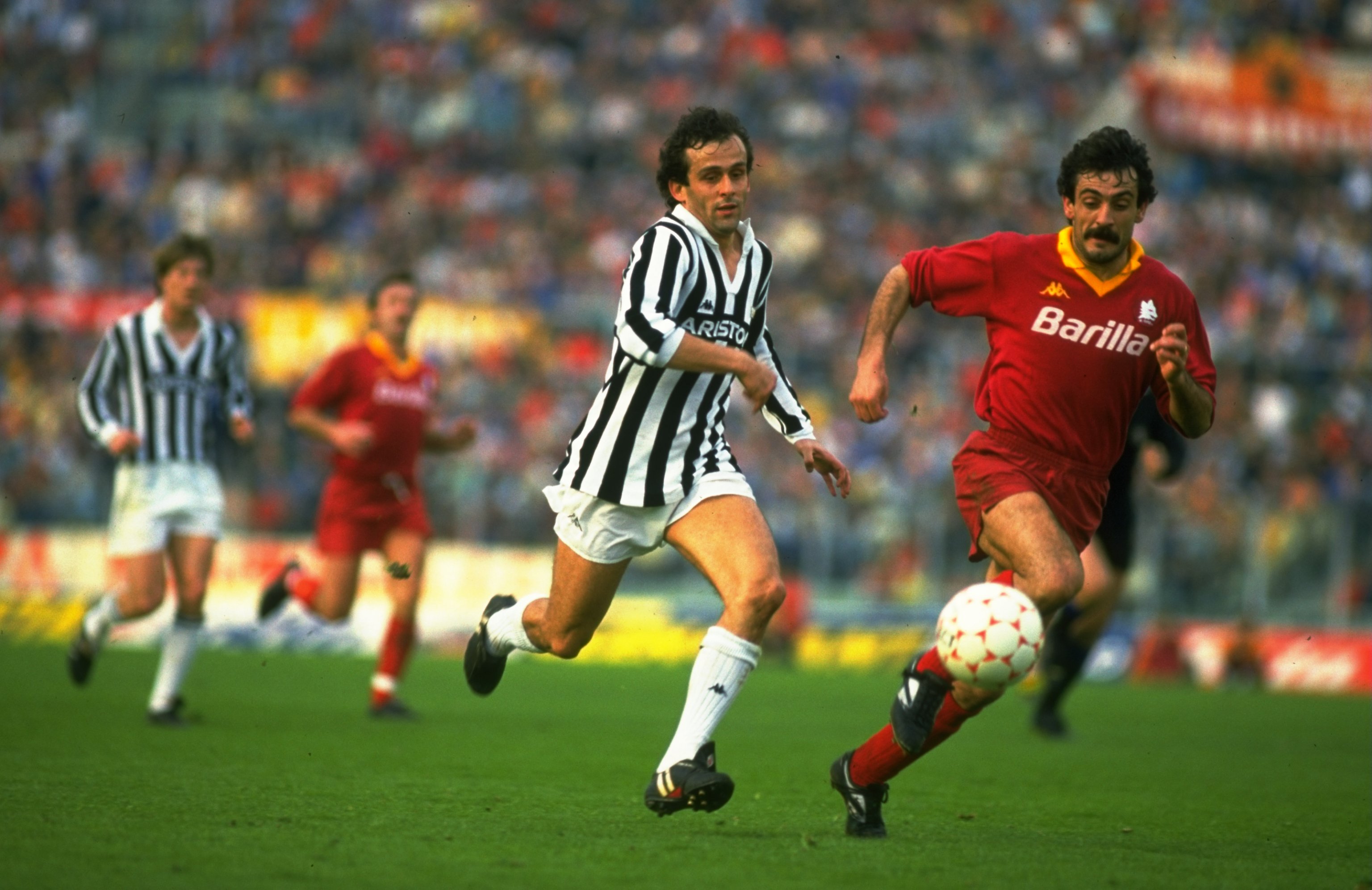 Undated: Michel Platini (left) of Juventus chases Emidio Oddi of Roma during an Italian League match at the Olympic Stadium in Rome. Roma won the match 3-0. \ Mandatory Credit: Allsport UK /Allsport
