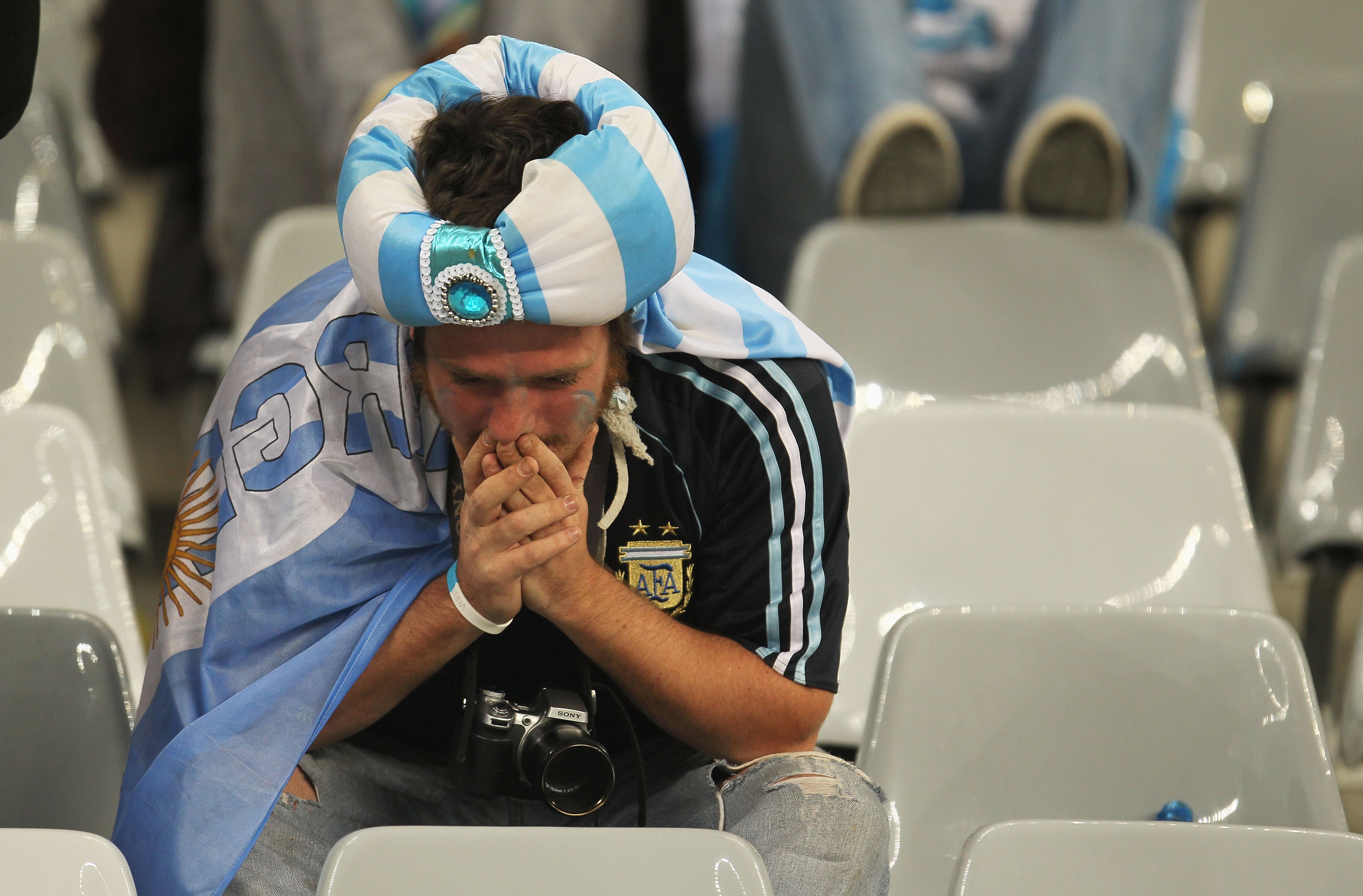 CAPE TOWN, SOUTH AFRICA - JULY 03:  A dejected Argentina fan after being knocked out of the competition following the 2010 FIFA World Cup South Africa Quarter Final match between Argentina and Germany at Green Point Stadium on July 3, 2010 in Cape Town, S