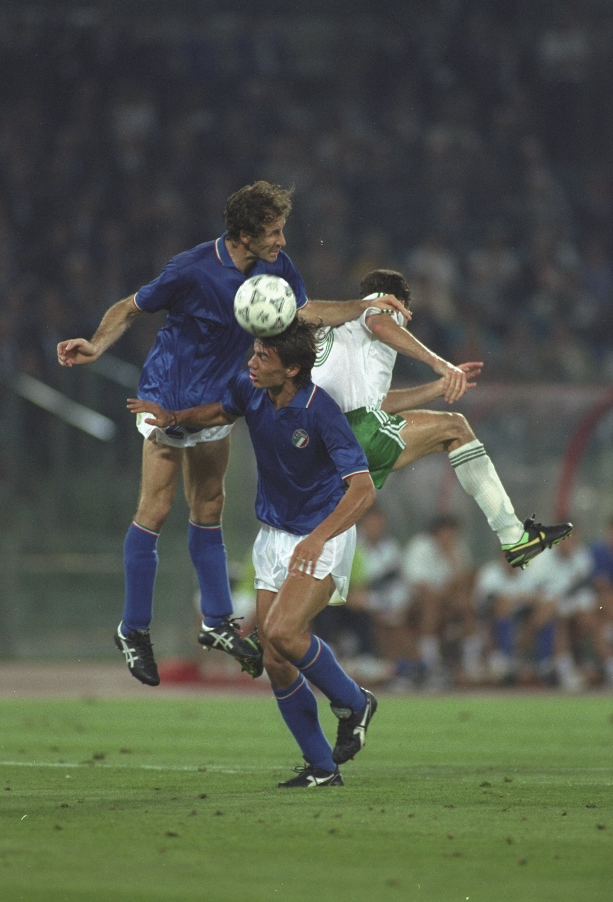 30 Jun 1990:  Franco Baresi (top left) and De Agostini (centre) both of Italy win the ball away from John Aldridge (right) of the Republic of Ireland during the World Cup Quarter Final match in Rome. Italy won the match 1-0. \ Mandatory Credit: David  Can