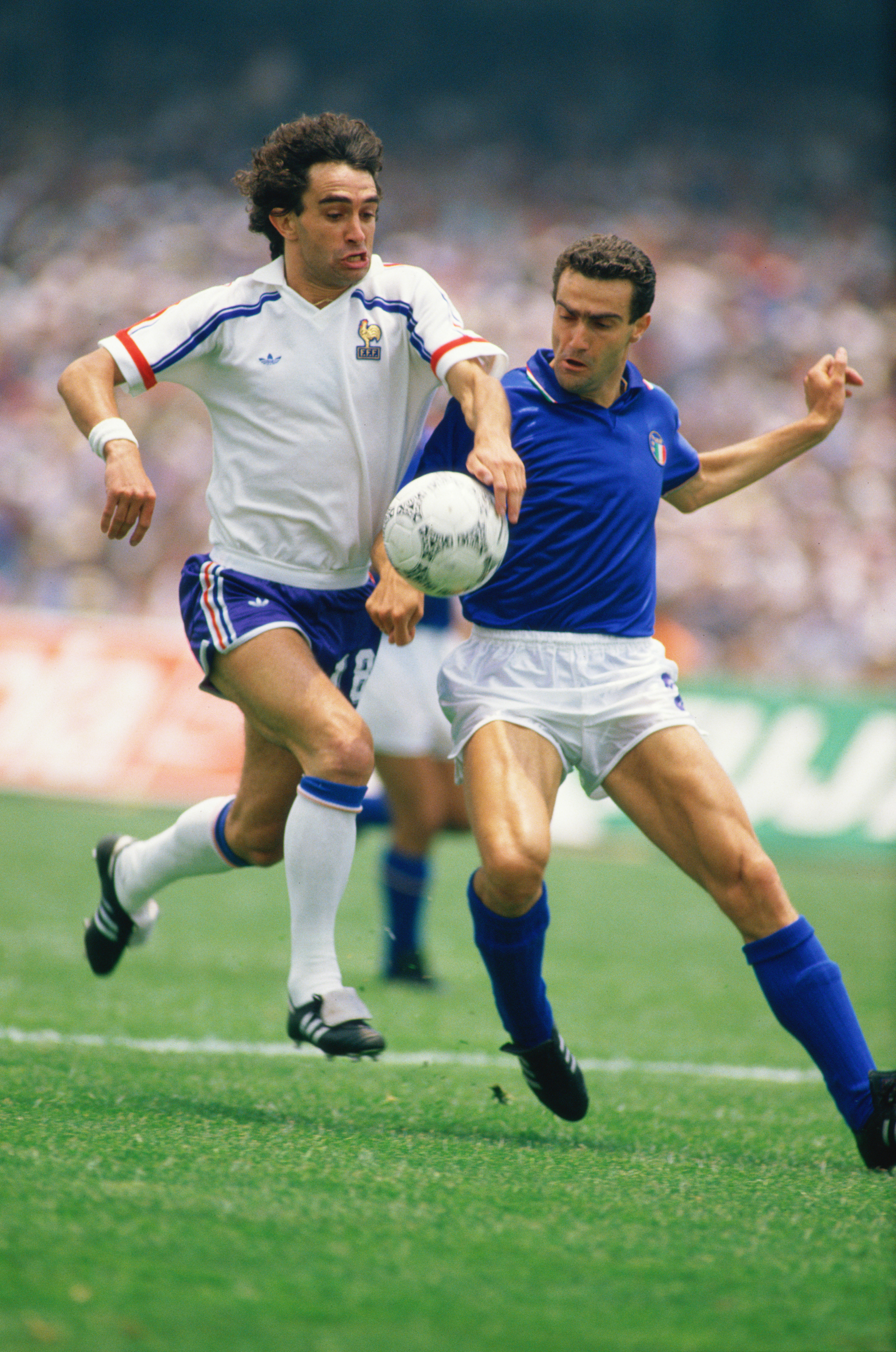 17 Jun 1986:  Dominique Rocheteau of France takes on Guiseppe Bergomi of Italy during the World Cup match in Mexico City. France won the match 2-0. \ Mandatory Credit: David  Cannon/Allsport