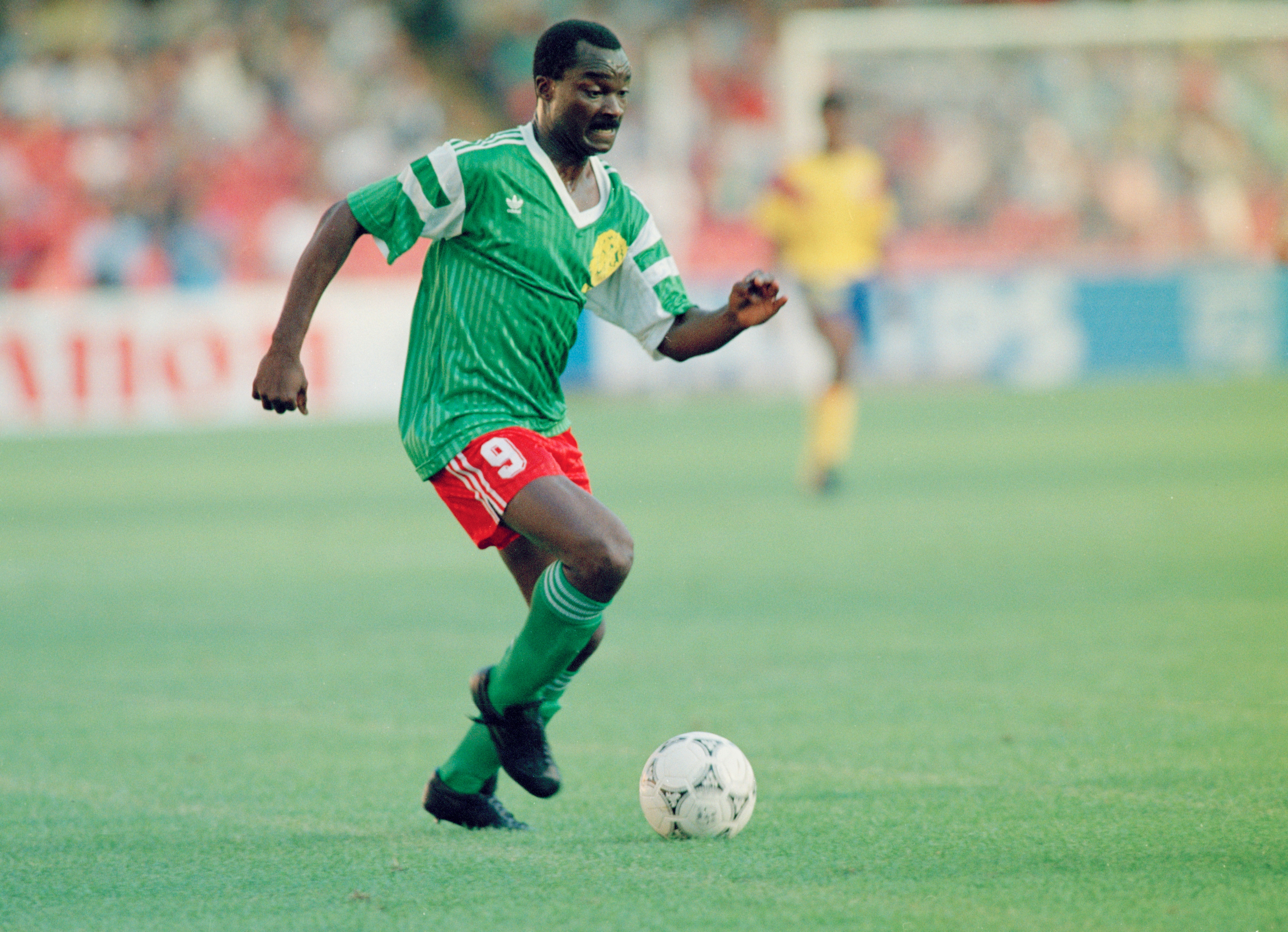 Cameroonian footballer Roger Milla in action against Colombia, during the knockout stage of the World Cup, at the Stadio San Paolo, Naples, Italy, 23rd June 1990. Cameroon woin the match 2-1. (Photo by Getty Images)