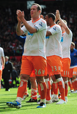 MANCHESTER, ENGLAND - MAY 22: A dejected Charlie Adam of Blackpool applauds the fans as Blackpool are relegated after the Barclays Premier League match between Manchester United and Blackpool at Old Trafford on May 22, 2011 in Manchester, England. (Phot