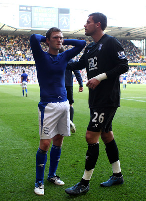 LONDON, ENGLAND - MAY 22: Craig Gardner (L) and Ben Foster of Birmingham City look dejected after their team was relegated during the Barclays Premier League match between Tottenham Hotspur and Birmingham City at White Hart Lane on May 22, 2011 in London