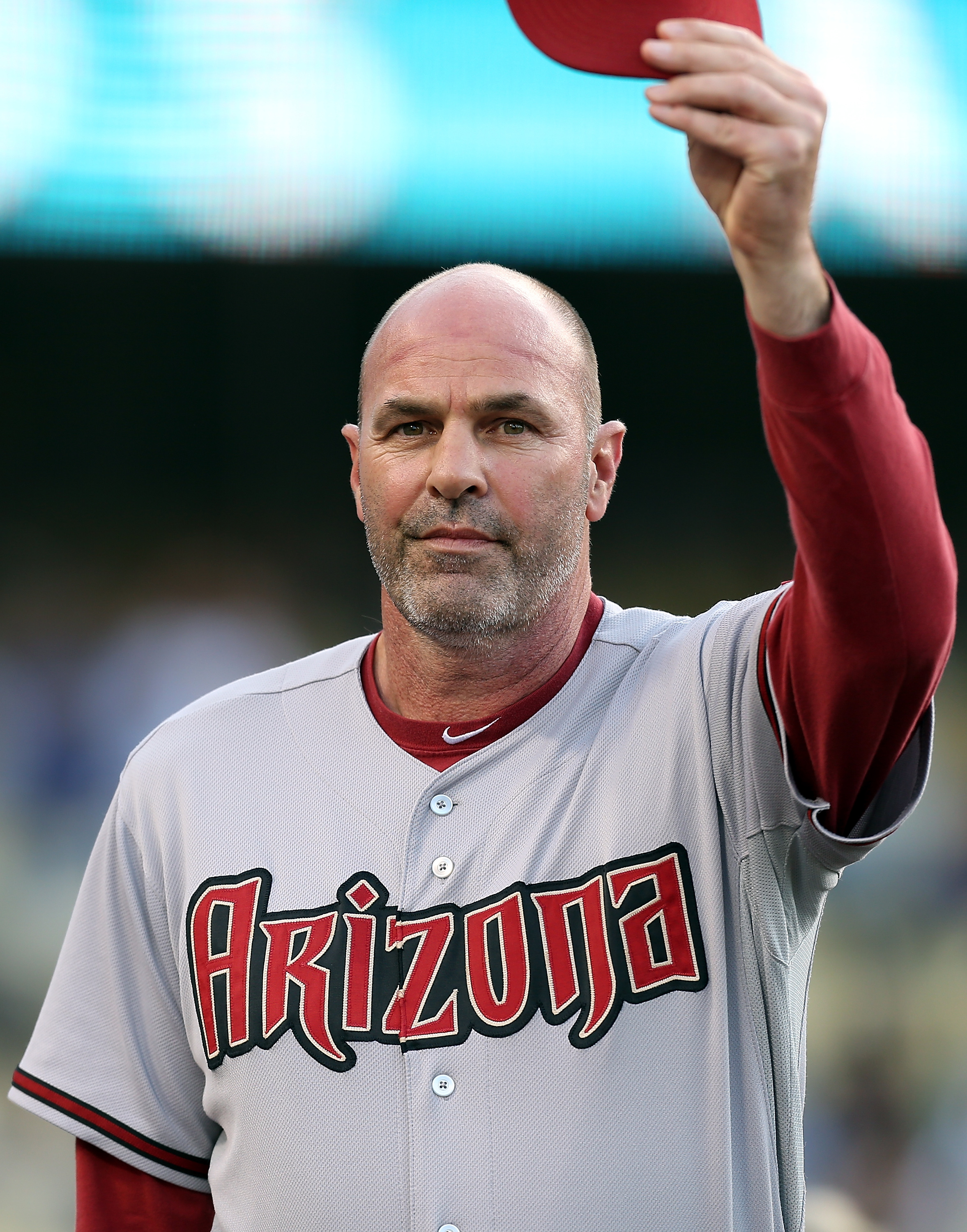 LOS ANGELES - JULY 31:  Arizona Diamondbacks manager Kirk Gibson salutes the crowd before a game against the Los Angeles Dodgers on Kirk Gibson Bobblehead Night at Dodger Stadium on July 31, 2012 in Los Angeles, California. (Photo by Josh Hedges/Getty Ima