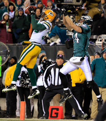 PHILADELPHIA, PA - JANUARY 09:  Tramon Williams #38 of the Green Bay Packers intercepts the pass intended for Riley Cooper #14 of the Philadelphia Eagles late in the fourth quarter during the 2011 NFC wild card playoff game at Lincoln Financial Field on J