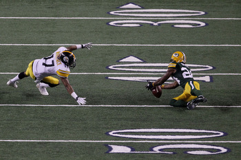 ARLINGTON, TX - FEBRUARY 06: Jarrett Bush #24 of the Green Bay Packers attempts to intercept the game's final pass against Mike Wallace #17 of the Pittsburgh Steelers in the fourth quarter as the ball hits the ground during Super Bowl XLV at Cowboys Stadi