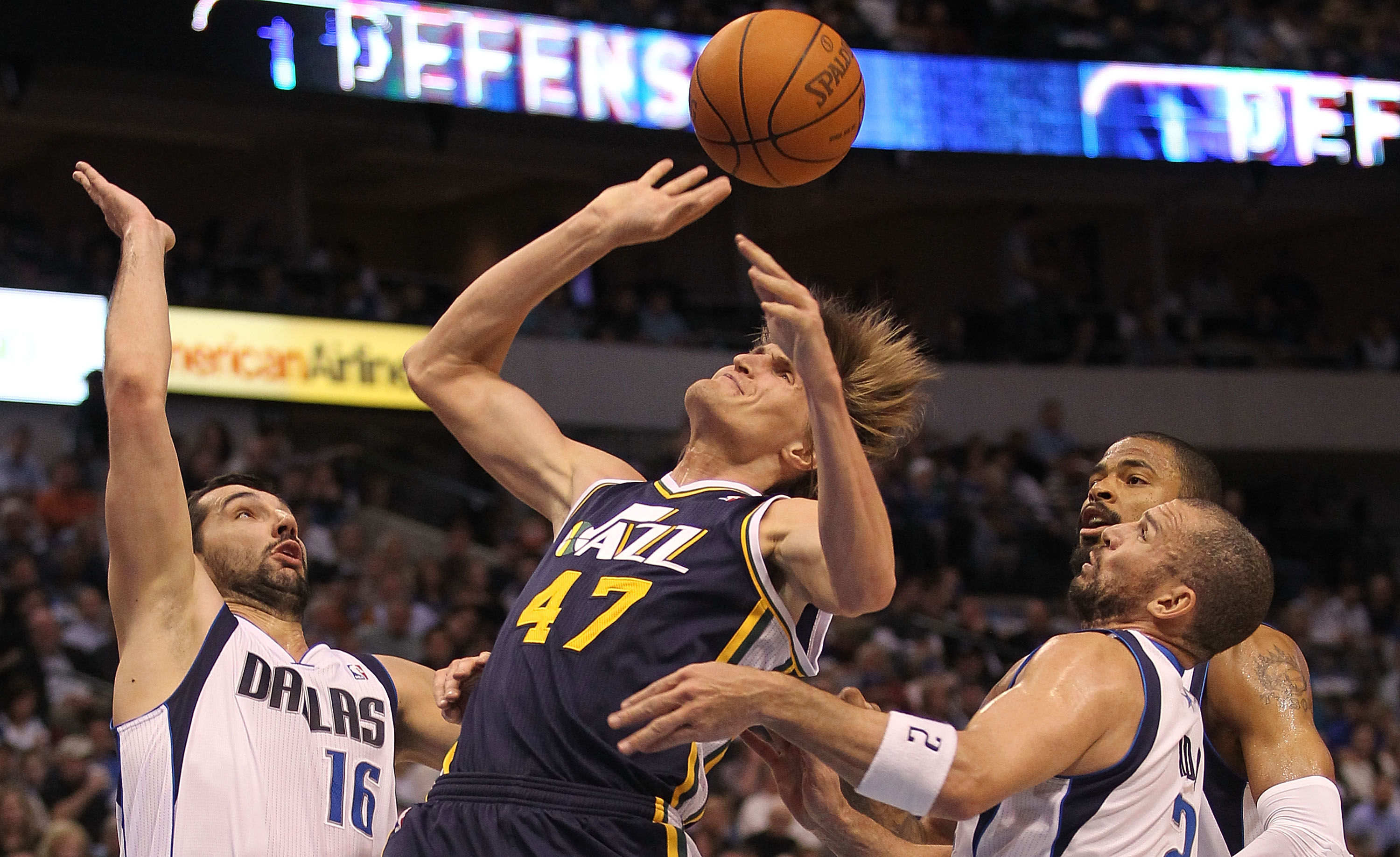 DALLAS, TX - FEBRUARY 23:  Forward Anrei Kirilenko #47 of the Utah Jazz is fouled by Jason Kidd #2 of the Dallas Mavericks at American Airlines Center on February 23, 2011 in Dallas, Texas.  NOTE TO USER: User expressly acknowledges and agrees that, by do