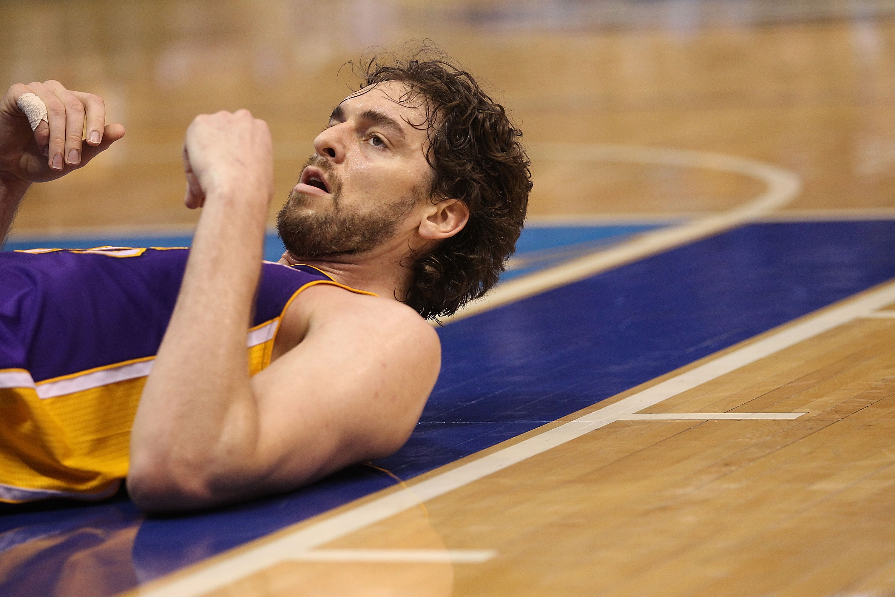DALLAS, TX - MAY 08: Forward Pau Gasol #16 of the Los Angeles Lakers on the ground after a foul by the Dallas Mavericks in Game Four of the Western Conference Semifinals during the 2011 NBA Playoffs on May 8, 2011 at American Airlines Center in Dallas, T