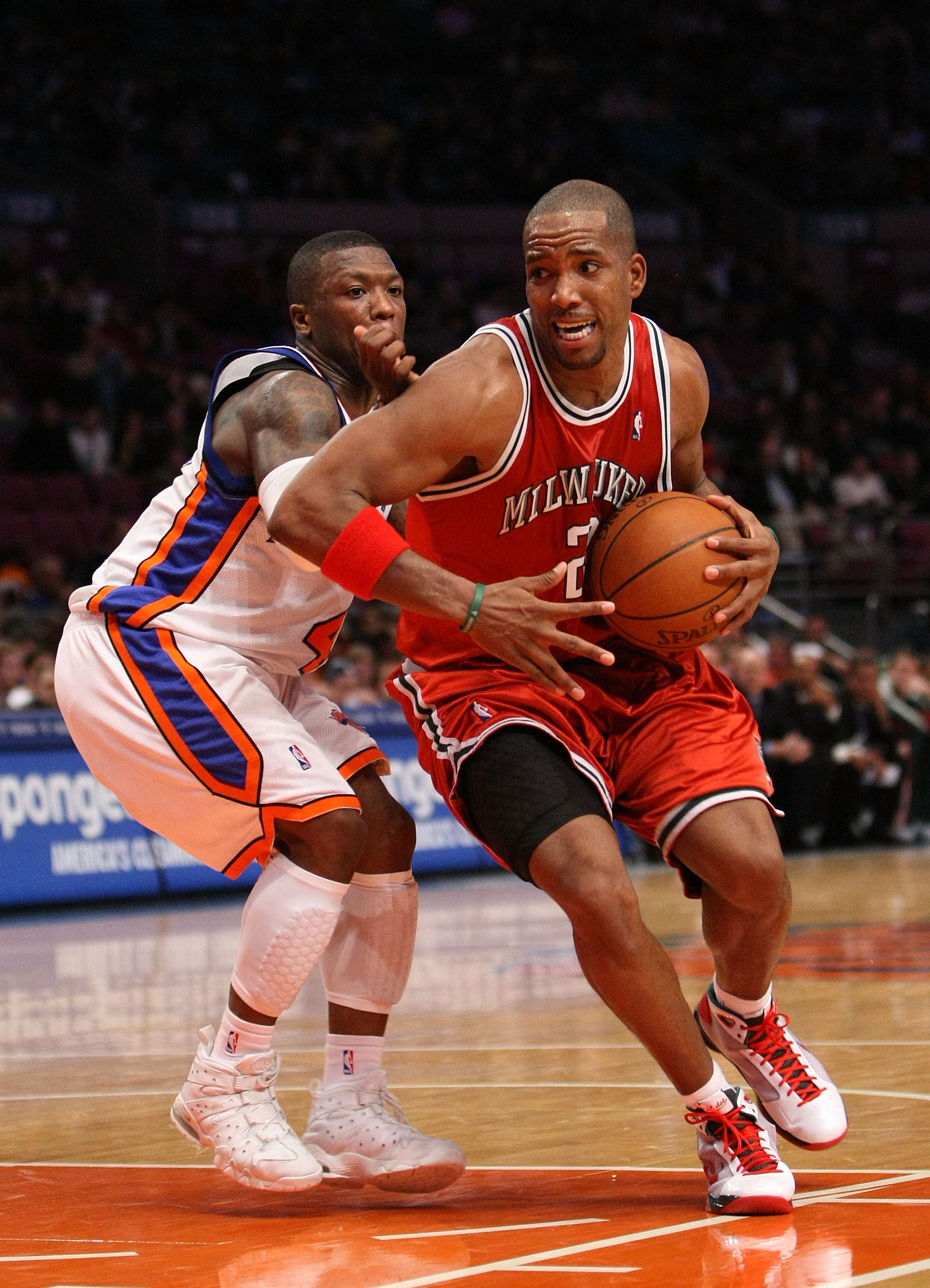 NEW YORK - DECEMBER 19: Michael Redd #22 of the Milwaukee Bucks drives to the basket against Nate Robinson #4 of the New York Knicks on December 19, 2008 at Madison Square Garden in New York City, New York. NOTE TO USER: User expressly acknowledges and ag