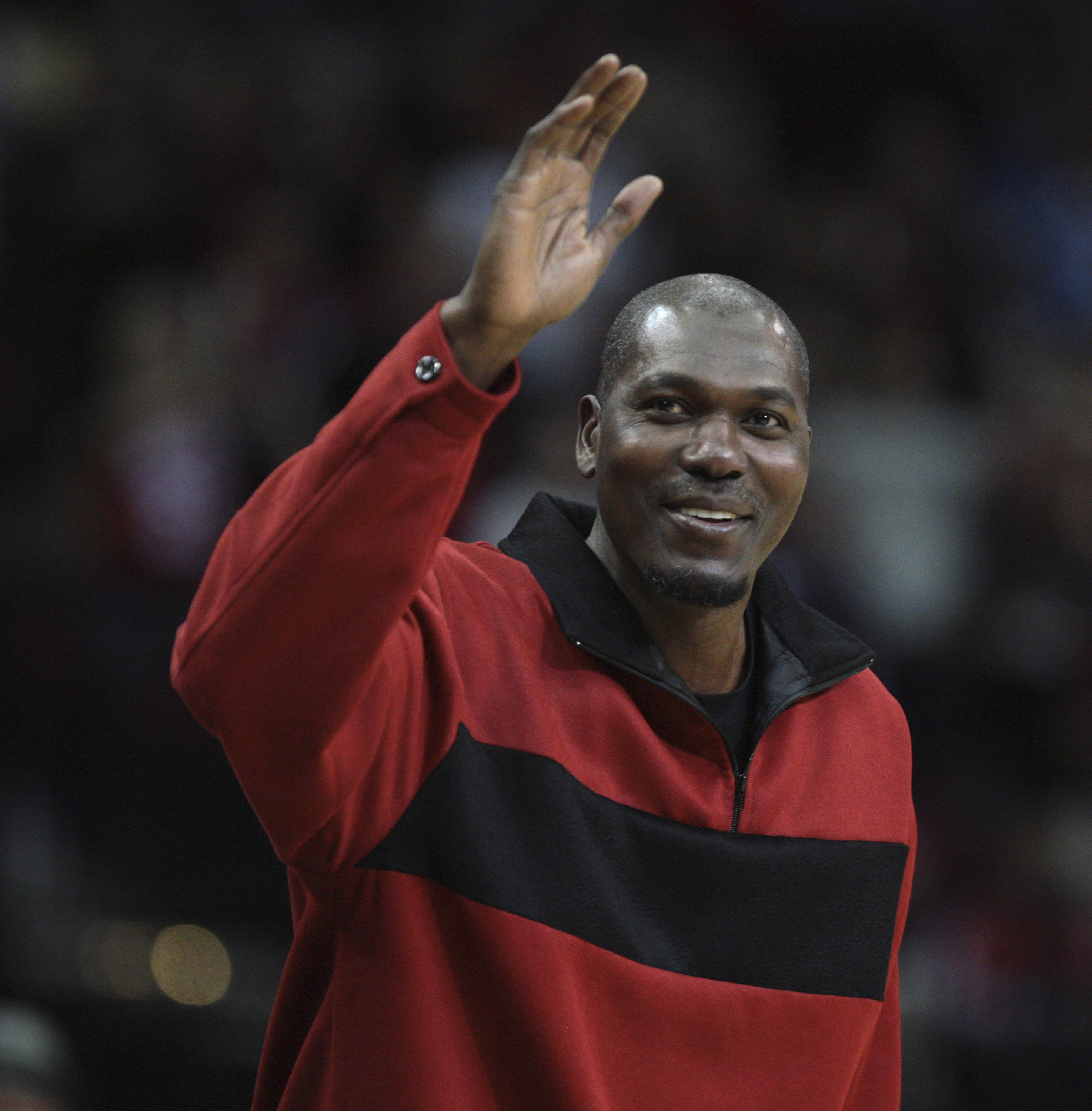 HOUSTON - DECEMBER 29: Former Houston Rockets Hakeem Olajuwon waves to the crowd as he is introduced to the crowd at Toyota Center on December 29, 2010 in Houston, Texas. NOTE TO USER: User expressly acknowledges and agrees that, by downloading and or u