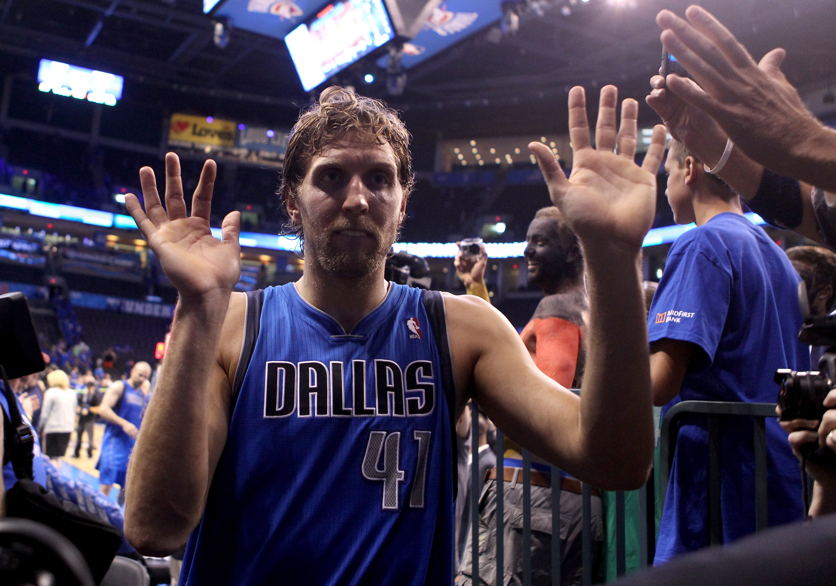 OKLAHOMA CITY, OK - MAY 23:  Dirk Nowitzki #41 of the Dallas Mavericks walks off the court after the Mavericks defeated the Oklahoma City Thunder 112-105 in overtime in Game Four of the Western Conference Finals during the 2011 NBA Playoffs at Oklahoma Ci