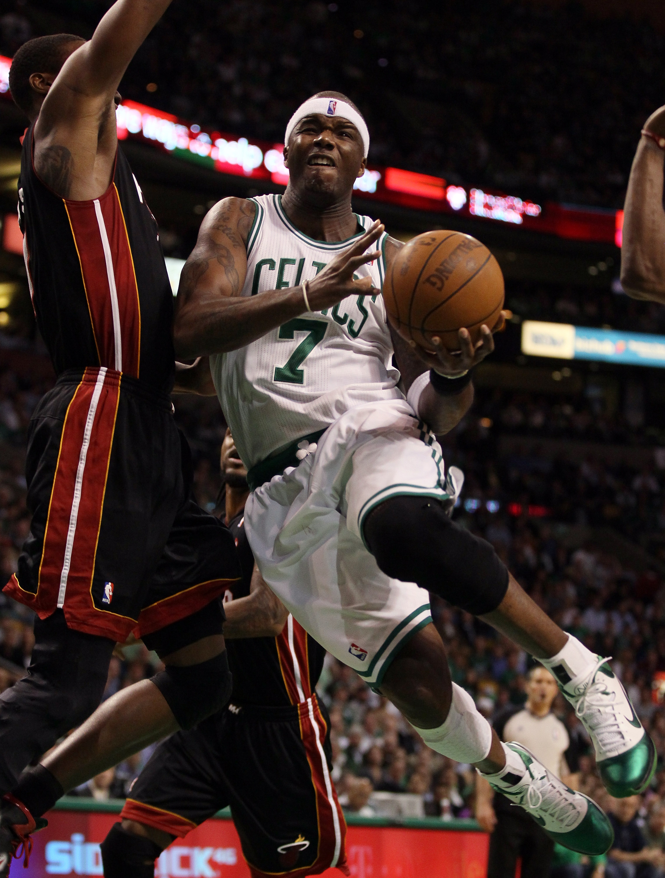 BOSTON, MA - MAY 09: Jermaine O'Neal #7 of the Boston Celtics drives past Mario Chalmers #15 of the Miami Heat in Game Four of the Eastern Conference Semifinals in the 2011 NBA Playoffs on May 9, 2011 at the TD Garden in Boston, Massachusetts. NOTE TO US